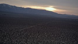 5K aerial stock footage orbit power lines and desert road at twilight in the Mojave Desert, California Aerial Stock Footage | AX0007_032