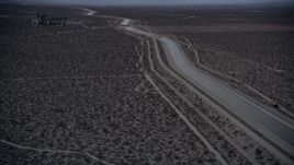 5K aerial  video orbit an aqueduct through the Mojave Desert at twilight, California Aerial Stock Footage | AX0007_037
