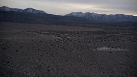 5K aerial stock footage approach an isolated home in the Mojave Desert at twilight, California Aerial Stock Footage | AX0007_038