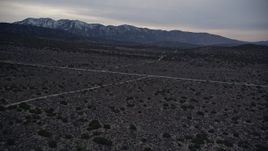 5K aerial stock footage fly over desert roads in Mojave Desert at twilight, California Aerial Stock Footage | AX0007_042