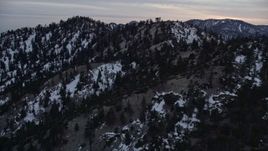 5K aerial stock footage of snowy mountain ridge at twilight in the San Gabriel Mountains in winter, California Aerial Stock Footage | AX0008_014