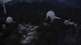 5K aerial stock footage orbit and fly away from the Mount Wilson Observatory at twilight in California Aerial Stock Footage | AX0008_050E