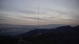 5K aerial stock footage orbit a radio tower in the San Gabriel Mountains at twilight, California Aerial Stock Footage | AX0008_056E