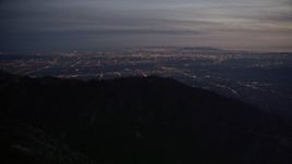5K aerial stock footage of suburban lights in San Gabriel Valley seen from mountains at twilight, California Aerial Stock Footage | AX0008_061