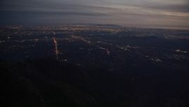 5K aerial stock footage of lights of suburban San Gabriel Valley at twilight in California Aerial Stock Footage | AX0008_062