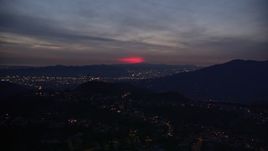 5K aerial stock footage approach red glow in the clouds above La Cañada Flintridge at night, California Aerial Stock Footage | AX0008_071