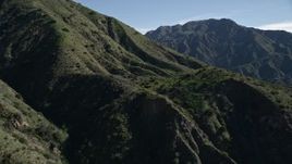 5K aerial stock footage approach steep slopes of green peaks in the San Gabriel Mountains, California, reveal mountain ridge Aerial Stock Footage | AX0009_006E