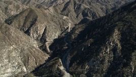 5K aerial stock footage fly over a mountain to reveal road and small bridge in the San Gabriel Mountains, California Aerial Stock Footage | AX0009_022