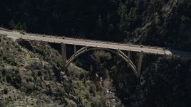 5K aerial stock footage of orbiting a small bridge in the San Gabriel Mountains, California Aerial Stock Footage | AX0009_023E