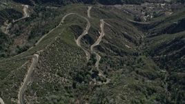 5K aerial stock footage of bird's eye view of winding mountain road in the San Gabriel Mountains, California Aerial Stock Footage | AX0009_041