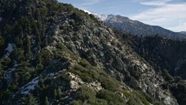 5K aerial stock footage approach and fly over slope with light snow in the San Gabriel Mountains, California Aerial Stock Footage | AX0009_049E