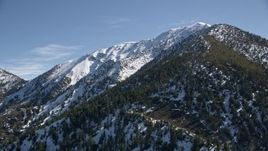 5K aerial stock footage of a snowy mountain peak in the San Gabriel Mountains, California Aerial Stock Footage | AX0009_057