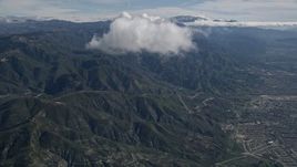 5K aerial stock footage approach cloud over the San Bernardino Mountains of California Aerial Stock Footage | AX0009_071E