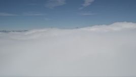 5K aerial stock footage fly over thick blanket of clouds over San Bernardino County, California Aerial Stock Footage | AX0009_102E