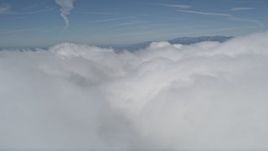 5K aerial stock footage flyby thick cloud cover, San Bernardino County, California Aerial Stock Footage | AX0009_104
