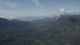 5K aerial stock footage of San Bernardino Mountains surrounding a valley in California Aerial Stock Footage | AX0009_126