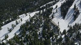 5K aerial stock footage orbit steep, snowy slopes at the Snow Summit Ski Resort in winter, California Aerial Stock Footage | AX0009_131