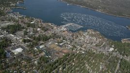 5K aerial stock footage orbit a small lakeside town on Big Bear Lake in winter, California Aerial Stock Footage | AX0009_138