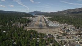 5K aerial stock footage orbit and approach the runway at Big Bear City Airport, California Aerial Stock Footage | AX0009_143E