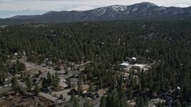5K aerial stock footage approach forest with snow at the edge of Big Bear Lake, California Aerial Stock Footage | AX0010_002