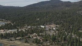 5K aerial stock footage of tracking a small airplane approaching Big Bear Lake, California Aerial Stock Footage | AX0010_008