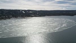 5K aerial stock footage of a large patch of winter ice on Big Bear Lake, California Aerial Stock Footage | AX0010_016