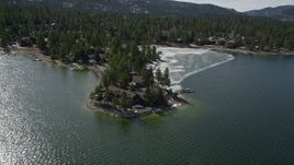 5K aerial stock footage orbit lakeside homes by an ice patch at Big Bear Lake, California Aerial Stock Footage | AX0010_018