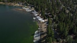 5K aerial stock footage of bird's eye view of lakeside homes with winter snow at Big Bear Lake, California Aerial Stock Footage | AX0010_037