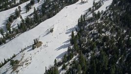 5K aerial stock footage of skiers and lift at the Snow Summit Ski Resort in winter, California Aerial Stock Footage | AX0010_041