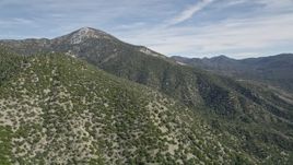 5K aerial stock footage of a wide orbit of a tall peak in the San Bernardino Mountains, California Aerial Stock Footage | AX0010_048