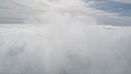 5K aerial stock footage of flying above thick cloud cover in Southern California Aerial Stock Footage | AX0010_074