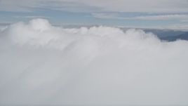 5K aerial stock footage fly over thick cloud cover in Southern California Aerial Stock Footage | AX0010_079