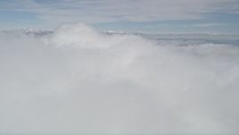 5K aerial stock footage flyby a thick bank of clouds over Southern California Aerial Stock Footage | AX0010_081
