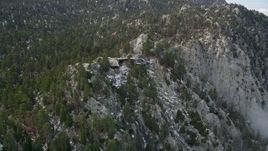 5K aerial stock footage tilt to reveal and approach a tram station in the San Jacinto Mountains, California Aerial Stock Footage | AX0010_111E