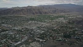 5K aerial stock footage tilt to reveal and approach neighborhoods in West Palm Springs, California Aerial Stock Footage | AX0010_130