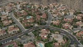 5K aerial stock footage orbiting a suburban neighborhood in West Palm Springs, California Aerial Stock Footage | AX0010_133