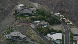 5K aerial stock footage orbiting a group of hilltop mansions in West Palm Springs, California Aerial Stock Footage | AX0010_136E