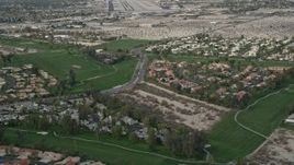 5K aerial stock footage orbit suburban neighborhoods and golf course in South Palm Springs, California Aerial Stock Footage | AX0010_140