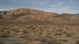 5K aerial stock footage low altitude flyby of desert mountains in Joshua Tree National Park, California Aerial Stock Footage | AX0011_013
