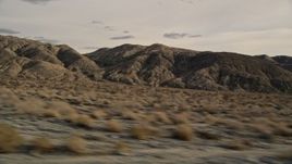 5K aerial stock footage fly low altitude by rugged desert mountains in Joshua Tree National Park, California Aerial Stock Footage | AX0011_014