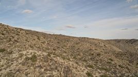5K aerial stock footage fly low over desert mountain slope, Joshua Tree National Park, California Aerial Stock Footage | AX0011_023E