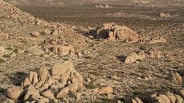 5K aerial stock footage of flying by rock formations, Joshua Tree National Park, California Aerial Stock Footage | AX0011_042