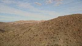 5K aerial stock footage reveal a desert mountain range, Mojave Desert, California Aerial Stock Footage | AX0011_047
