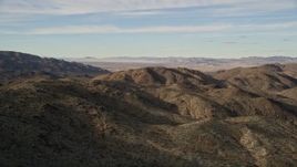 5K aerial stock footage fly by desert mountains, Mojave Desert, California Aerial Stock Footage | AX0011_048