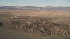 5K aerial stock footage of desert hills and rural areas, Mojave Desert, California Aerial Stock Footage | AX0011_059