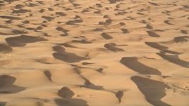5K aerial stock footage fly across sand dunes, Kelso Dunes, Mojave Desert, California Aerial Stock Footage | AX0012_010