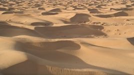 5K aerial stock footage fly low over sand dunes, Kelso Dunes, Mojave Desert, California Aerial Stock Footage | AX0012_011E