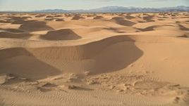 5K aerial stock footage fly low over sand dunes, Kelso Dunes, Mojave Desert, California Aerial Stock Footage | AX0012_013