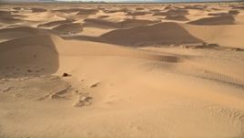 5K aerial stock footage fly by sand dunes, Kelso Dunes, Mojave Desert, California Aerial Stock Footage | AX0012_014