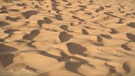 5K aerial stock footage pan across sand dunes, Kelso Dunes, Mojave Desert, California Aerial Stock Footage | AX0012_021E